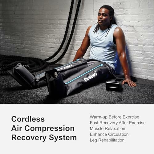 Person using cordless air compression recovery system for leg rehabilitation.
