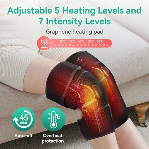 Person using graphene heating pad on knee with adjustable heating levels.