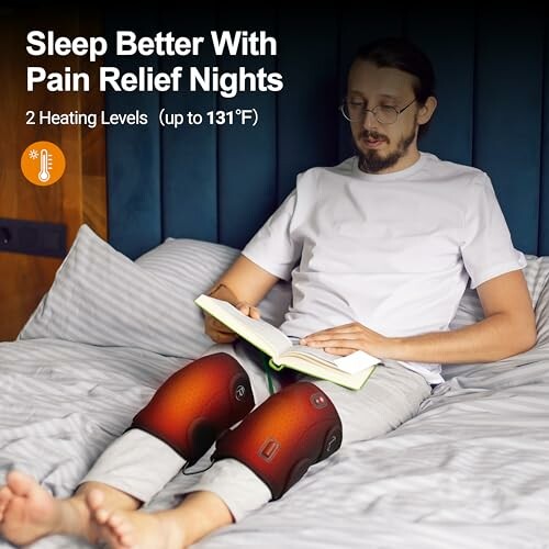 Man using heated knee wraps while reading in bed.