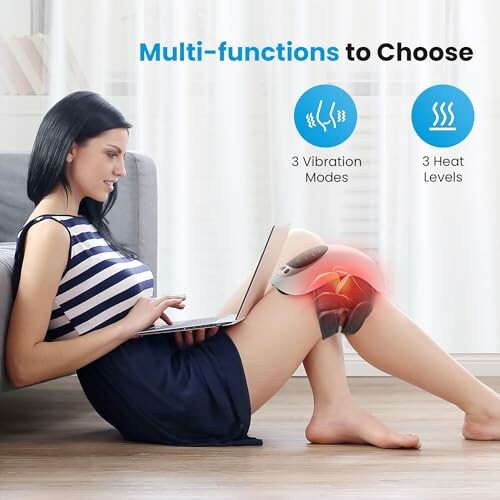 Woman using knee massager with laptop, showing vibration and heat options.