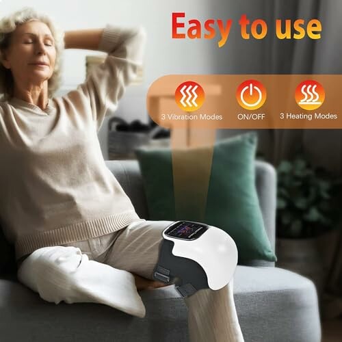Woman using knee massager with heating and vibration modes.