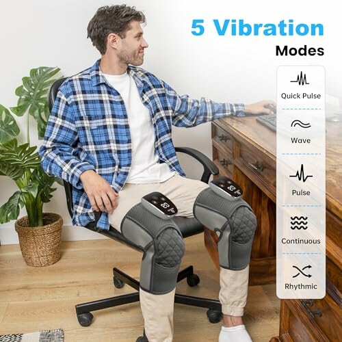 Man sitting in a chair using a leg massager with 5 vibration modes displayed.