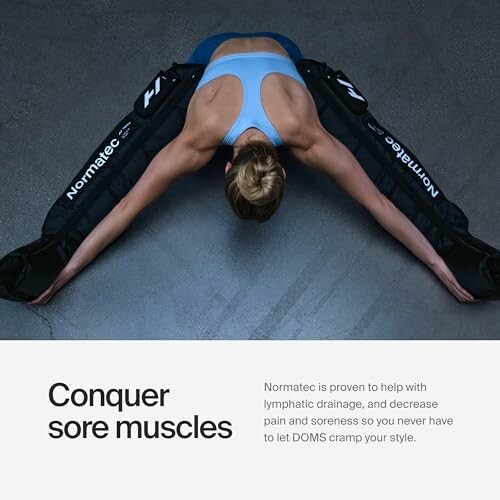 Woman stretching with Normatec compression sleeves.